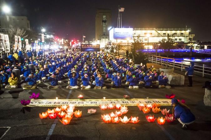 Falun Gong practitioners attend a candlelight vigil near the Chinese Consulate in New York on April 23, 2017. (Samira Bouaou/The Epoch Times)