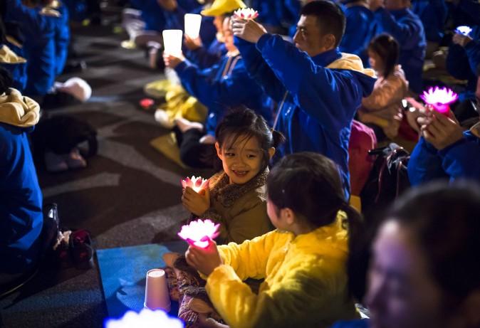 Young Falun Gong practitioner attend a candlelight vigil near the Chinese Consulate in New York on April 23, 2017. (Samira Bouaou/The Epoch Times)