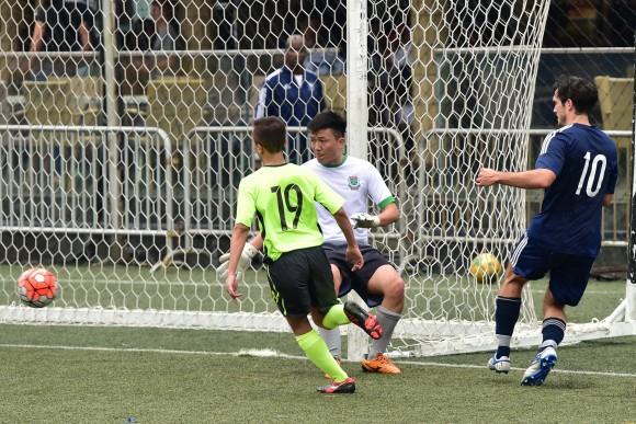 Another chance for Albion in their Yau Yee League match with KCC Knights as the ball is passed across the KCC goal by Albion No 10, Antoine Gael Sahagian, but it could not be converted. (Bill Cox/Epoch Times)