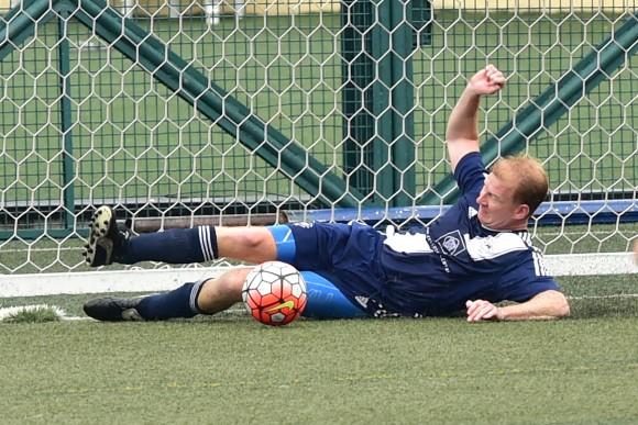 Thomas Pugh scrambles back for Albion to just stop a goal by KCC Knights in their Yau Yee League match at Sports Road on Sunday April 23, 2017. (Bill Cox/Epoch TImes)