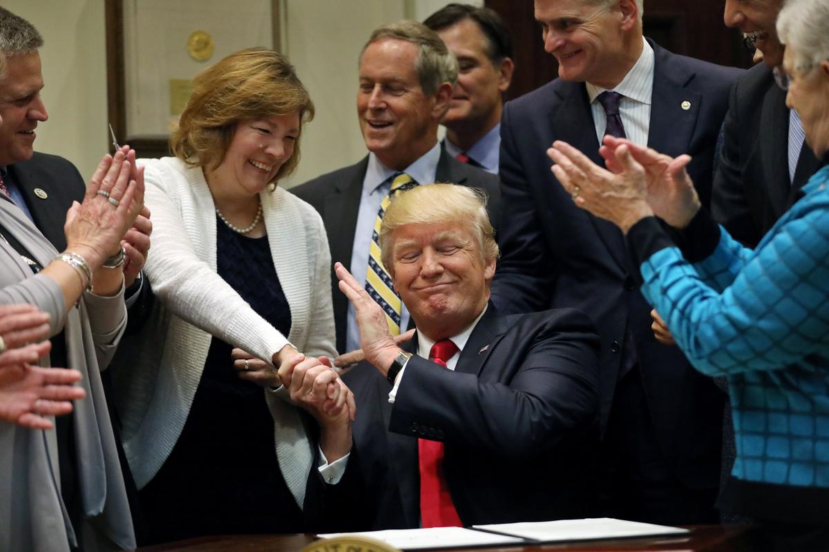 President Donald Trump reacts after signing an executive order on education during an event with Governors at the White House in Washington on April 26, 2017. (REUTERS/Carlos Barria)