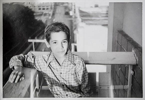 Jesús de León as a young boy on his aunt's balcony in Havana in the early 1970s. (Courtesy of Jesús de León)