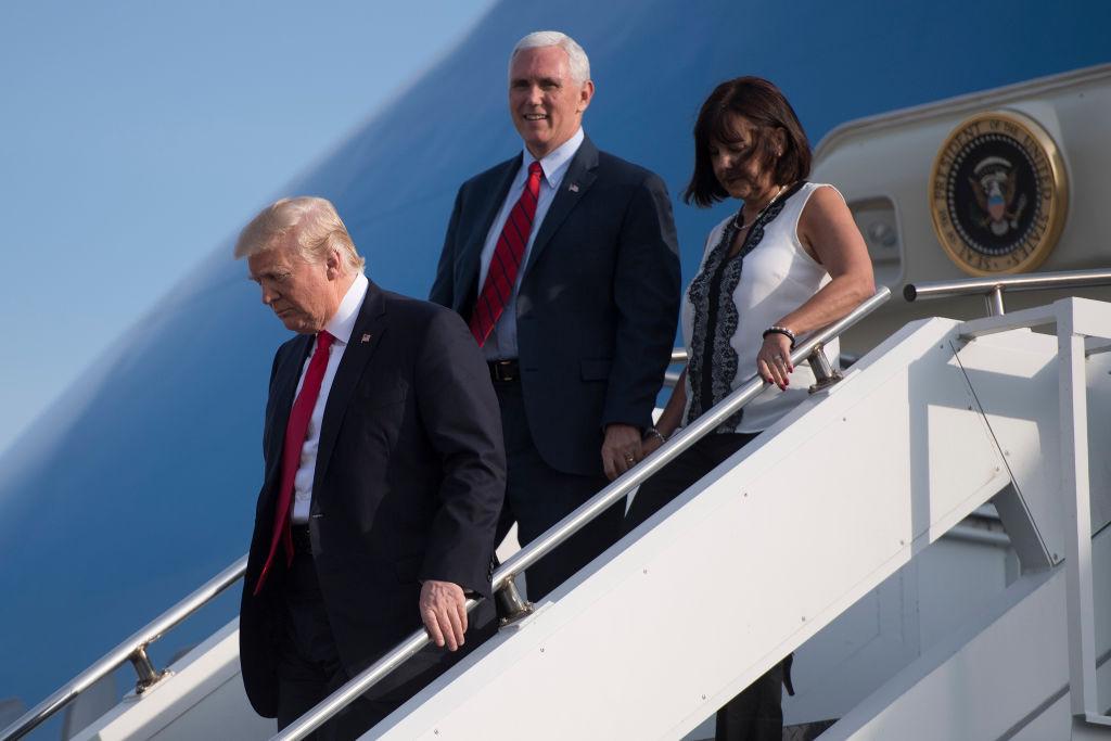 President Donald Trump (L) steps off Air Force One with Vice President Mike Pence and his wife Karen Pence n Middletown, Pa., on April 29, 2017. (JIM WATSON/AFP/Getty Images)