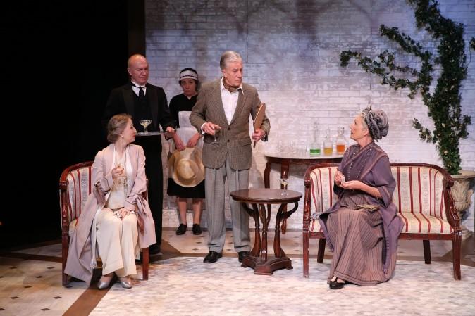 Lord Richard Kettlewell (Brian Protheroe) is having trouble with his mistress, Hilda Lancicourt (L, Carol Starks) and his ex-wife, Lady Kettlewell (Lisa Bowerman), while his servants, played by Derek Hutchinson and Annie Jackson, look on. (Carol Rosegg)