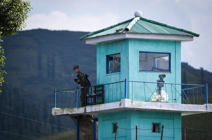 A North Korean soldier mans a guard post near the North Korean town of Sinuiju, opposite of the Chinese border city of Dandong on Sept. 11, 2016. (GREG BAKER/AFP/Getty Images)