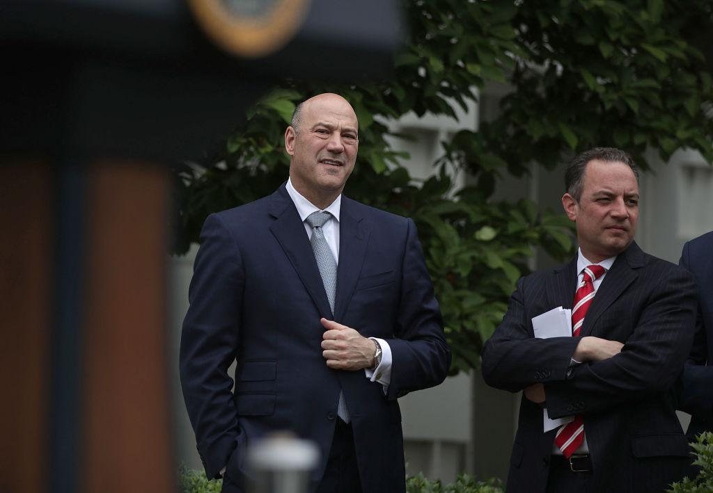 Director of the National Economic Council Gary Cohn (L) and White House Chief of Staff Reince Priebus (R) listen druing an event at the Kennedy Garden of the White House in Washington on May 1, 2017. (Alex Wong/Getty Images)