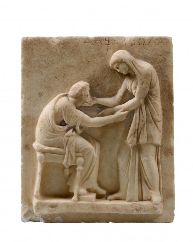 Funerary Stele. Marble, early third century B.C., from the Cemetery of Ancient Thera. Archaeological Museum of Thera. Hellenic Ministry of Culture and Sports–Archaeological Receipts Fund. (Kostas Xenikakis)