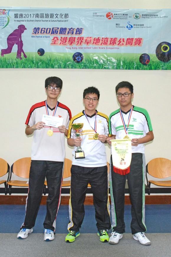 Lyndon Sham (from L), Rayson Law and Tim Sham from Yan Oi Tong Tin Ka Ping Secondary School worked together to win the third successive Hong Kong Inter-schools Lawn Bowls Competition title for their school. (Stephanie Worth)