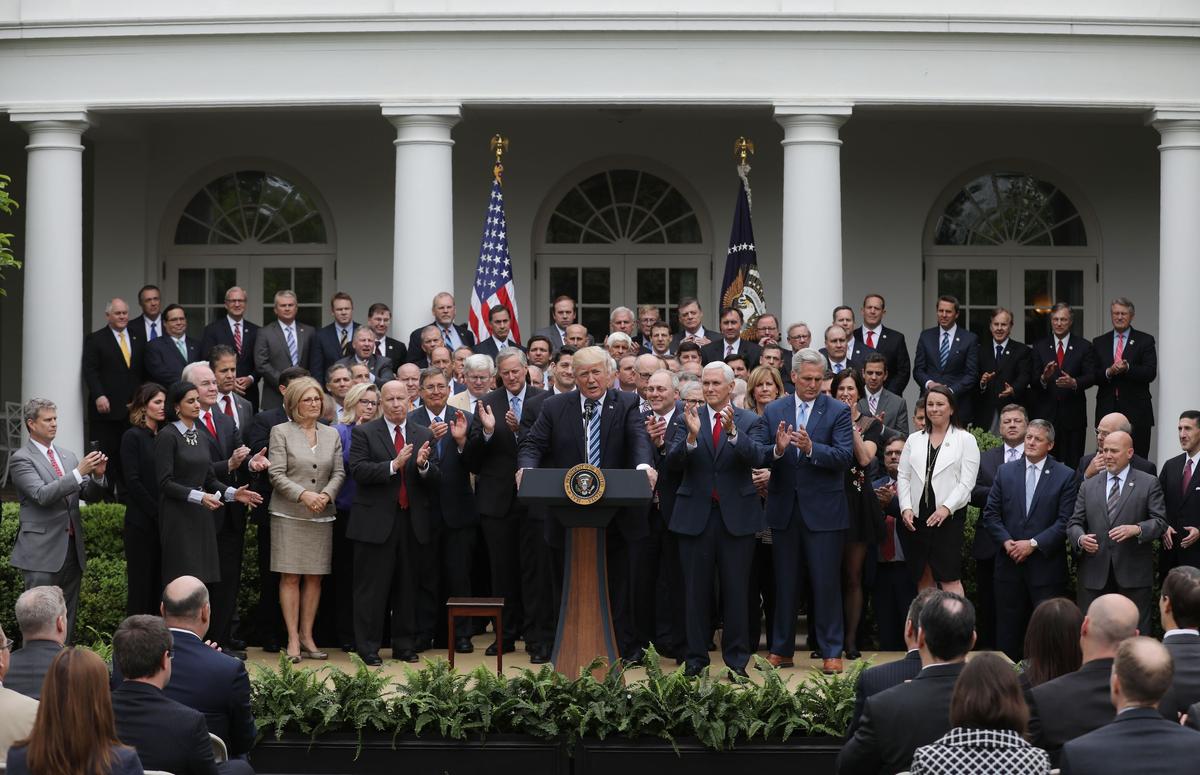 President Donald Trump (C) gathers with Congressional Republicans in the Rose Garden of the White House after the House of Representatives approved the American Healthcare Act, to repeal major parts of Obamacare and replace it with the Republican healthcare plan, in Washington on May 4, 2017. (REUTERS/Carlos Barria)