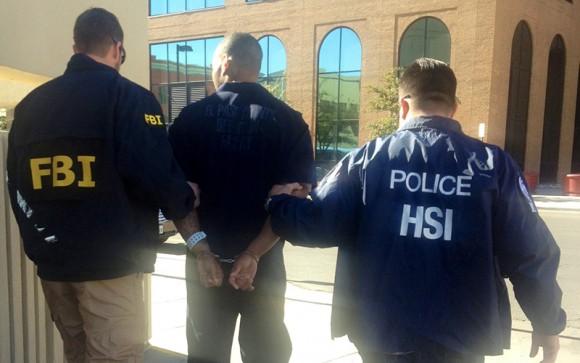 Timothy McCullouch Jr., a juvenile probation officer, is arrested by HSI and FBI special agents on federal sex trafficking charges, in El Paso, Texas, on Jan. 17, 2014. (ICE)