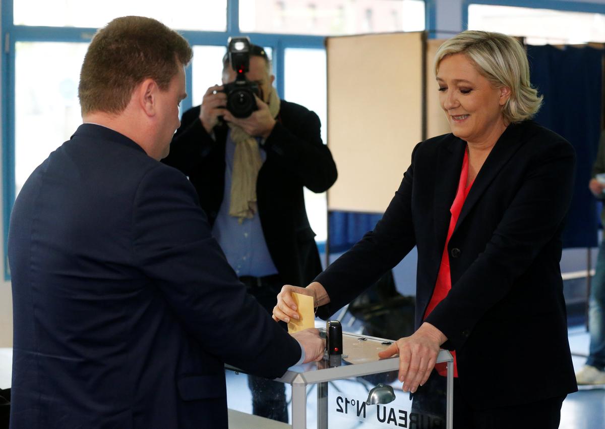 Marine Le Pen, French National Front (FN) political party candidate for French 2017 presidential election, casts her ballot in the second round of 2017 French presidential election at a polling station in Henin-Beaumont, France on May 7, 2017. (REUTERS/Pascal Rossignol)