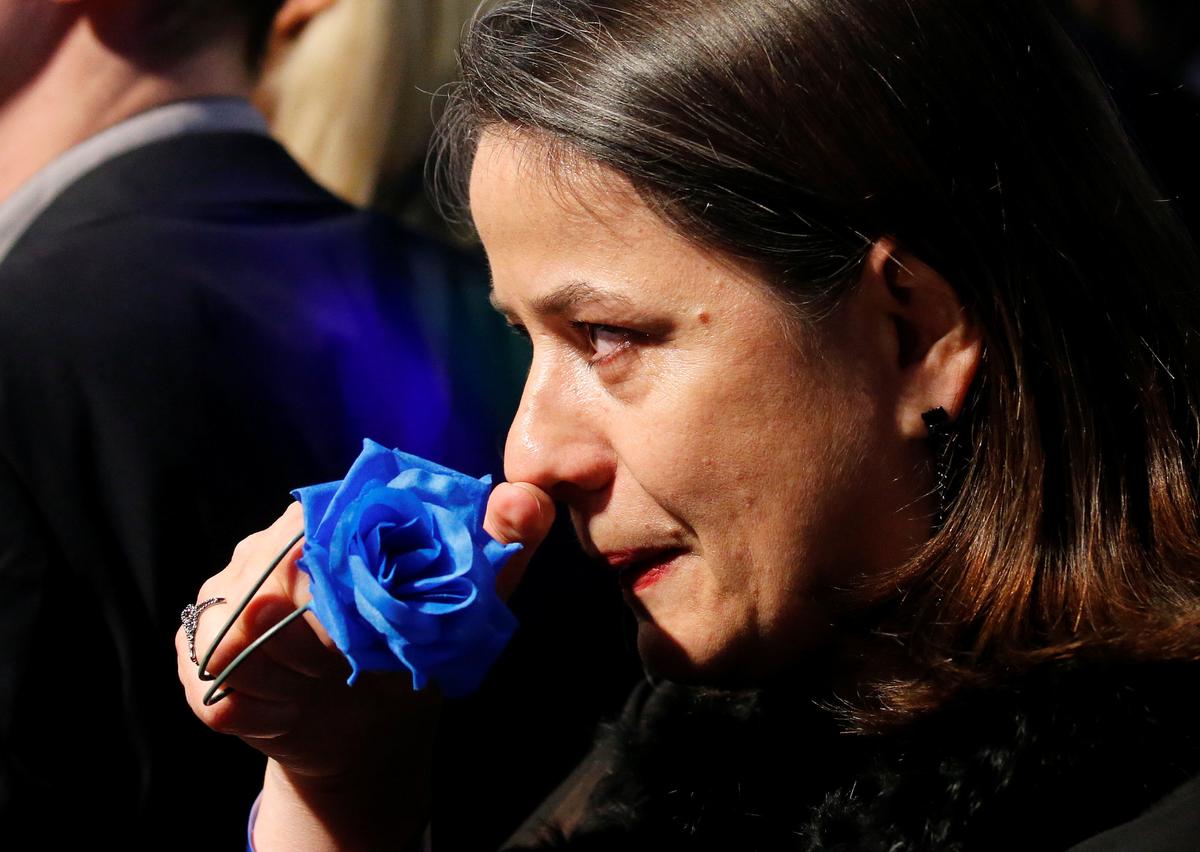 A supporter of Marine Le Pen, French National Front (FN) political party candidate for French 2017 presidential election, in tears at her campaign headquarters after her defeat in the secound round of 2017 French presidential election, Paris, France on May 7, 2017. (REUTERS/Pascal Rossignol)