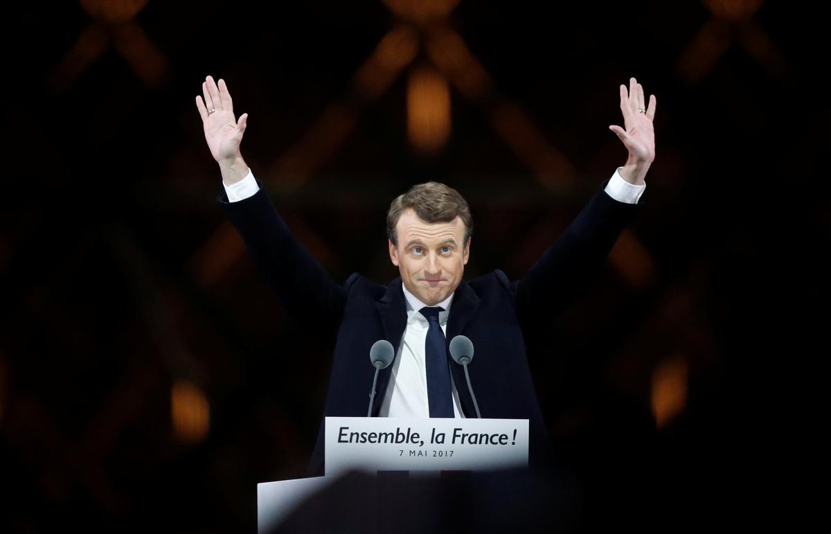 French President-elect Emmanuel Macron celebrates on the stage at his victory rally near the Louvre in Paris, France on May 7, 2017. (REUTERS/Christian Hartmann)