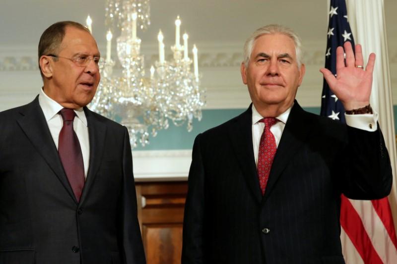 Secretary of State Rex Tillerson (R) waves to the media next to Russian Foreign Minister Sergey Lavrov before their meeting at the State Department in Washington on May 10, 2017. (REUTERS/Yuri Gripas)