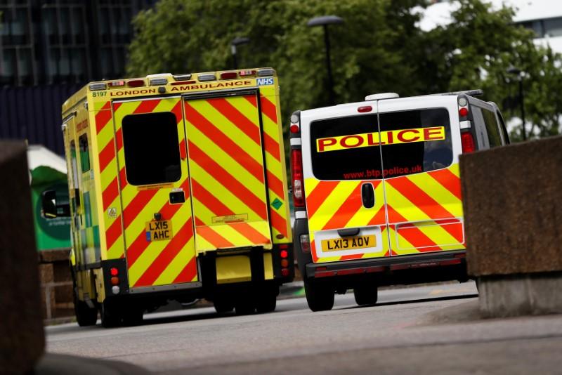 An ambulance waits next to a police car, outside the emergency department, at St Thomas' Hospital in central London, Britain on May 12, 2017. (REUTERS/Stefan Wermuth)