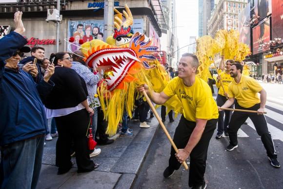 A Falun Gong dragon dance team performs in the World Falun Dafa Day parade in New York on May 12, 2017. (Samira Bouaou/The Epoch Times)