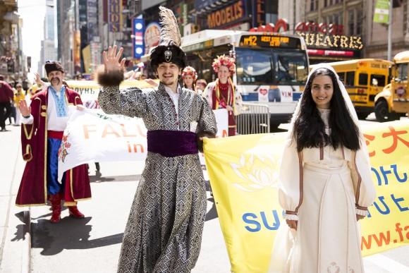 Thousands of Falun Gong practitioners march in a parade along 42nd Street in New York for World Falun Dafa Day on May 12, 2017. (Samira Bouaou/The Epoch Times)