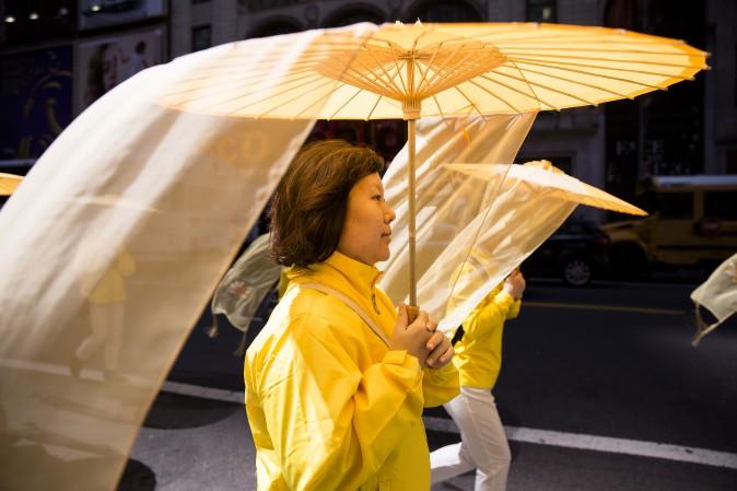 Thousands of Falun Gong practitioners march in a parade along 42nd Street in New York for World Falun Dafa Day on May 12, 2017. (Samira Bouaou/The Epoch Times)