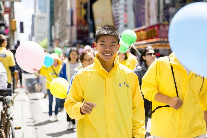 Thousands of Falun Gong practitioners march in a parade along 42nd Street in New York for World Falun Dafa Day on May 12, 2017. (Samira Bouaou/The Epoch Times)