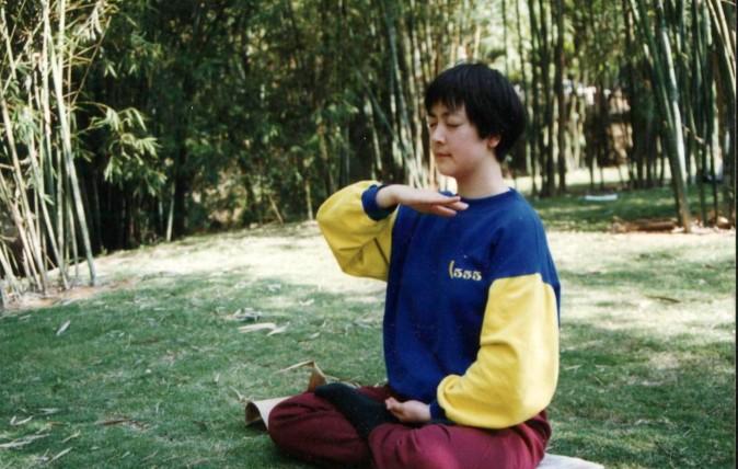 Jennifer Zeng practicing the Falun Gong meditation in 1998 in a park in Shenzhen City, China. (courtesy Jennifer Zeng)