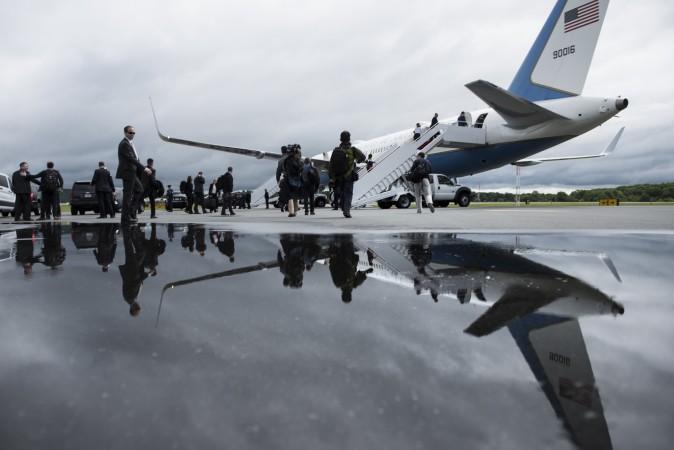 Traveling press and White House staff board Air Force One at Lynchburg Regional Airport in Lynchburg, Va., on May 13, 2017. (BRENDAN SMIALOWSKI/AFP/Getty Images)
