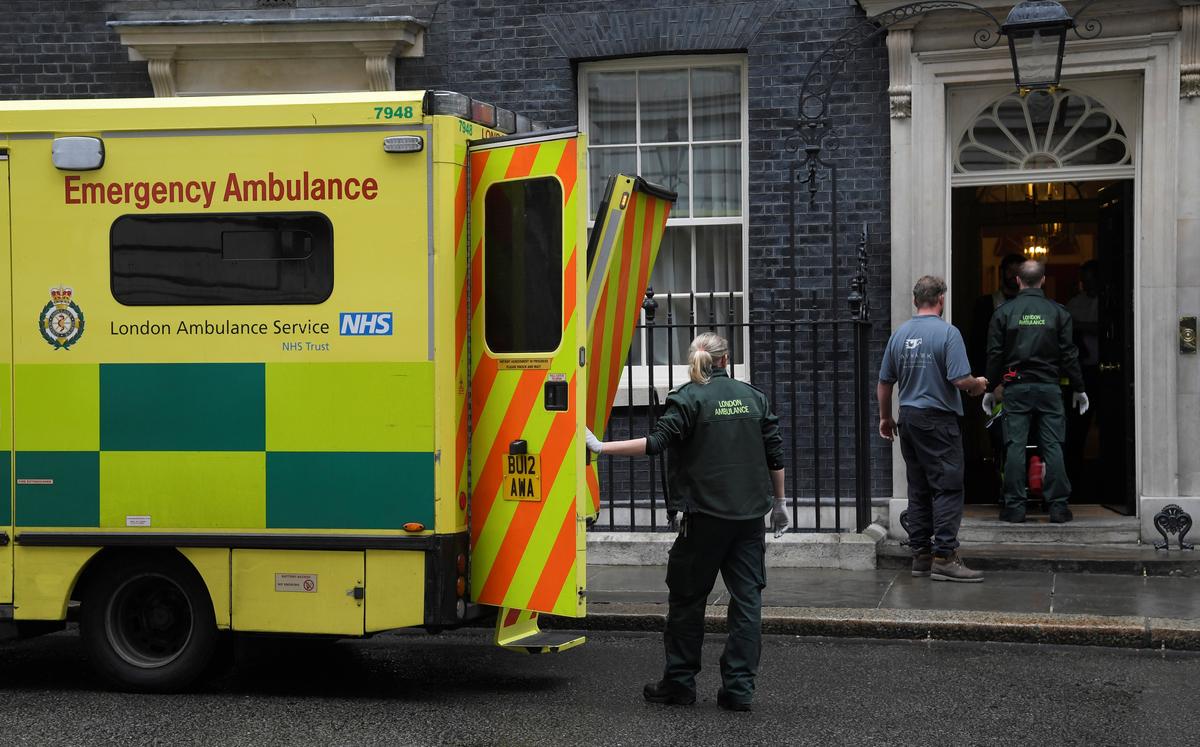 Paramedics carry a patient to an ambulance parked outside 10 Downing Street in London, Britain on May 15, 2017. (REUTERS/Toby Melville)