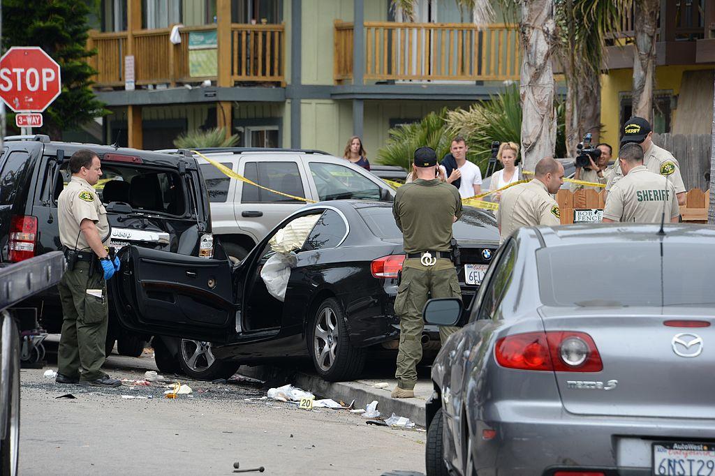 Investigators inspect a suspected gunman's car on May 24, 2014, after a drive-by shooting in Isla Vista, California, a beach community next to the University of California Santa Barbara. (ROBYN BECK/AFP/Getty Images)