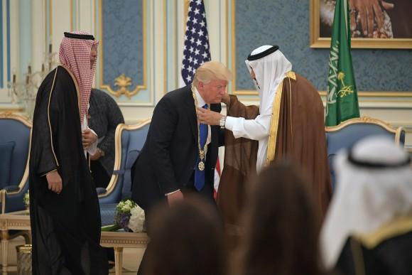 US President Donald Trump (C) receives the Order of Abdulaziz al-Saud medal from Saudi Arabia's King Salman bin Abdulaziz al-Saud (R) at the Saudi Royal Court in Riyadh on May 20, 2017. (Mandel Ngan/AFP/Getty Images)