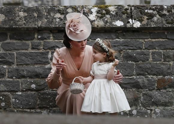 Catherine, Duchess of Cambridge speaks to Princess Charlotte after the wedding of Pippa Middleton and James Matthews at St Mark's Church on May 20, 2017 in in Englefield, England. (Kirsty Wigglesworth - Pool/Getty Images)