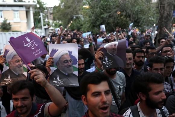 Supporters of newly re-elected Iranian President Hassan Rouhani take to the streets to celebrate his victory in downtown Tehran on May 20, 2017. (Behrouz Mehri/AFP/Getty Images)