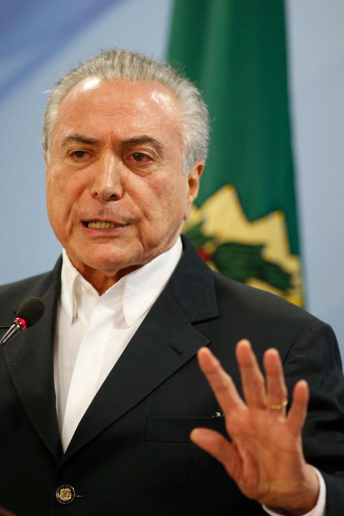 Brazilian President Michel Temer delivers a new statement following the release of a tape allegedly demonstrating him condoning bribery payments to Chamber of Deputies President Eduardo Cunha in Brasilia, Brazil on May 20, 2017. (Getty Image)
