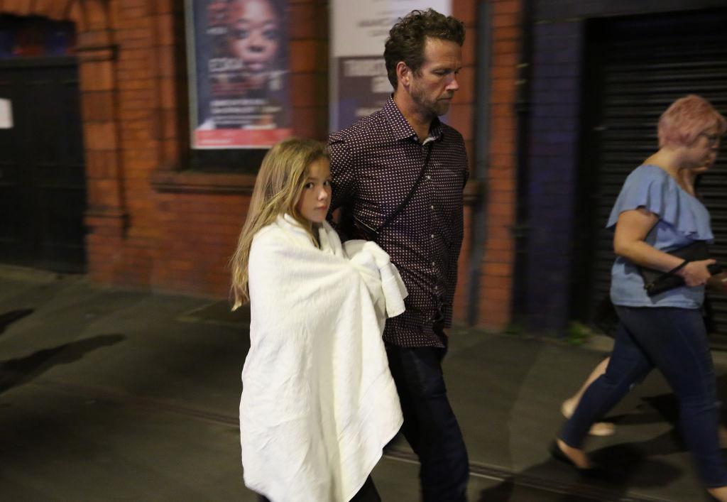 Police escort members of the public from the Manchester Arena in Manchester, England on May 23, 2017. (Christopher Furlong/Getty Images)