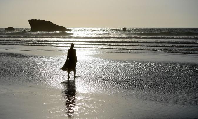 A woman walks on the beach in Biarritz, southwestern France, on May 23, 2017. (FRANCK FIFE/AFP/Getty Images)