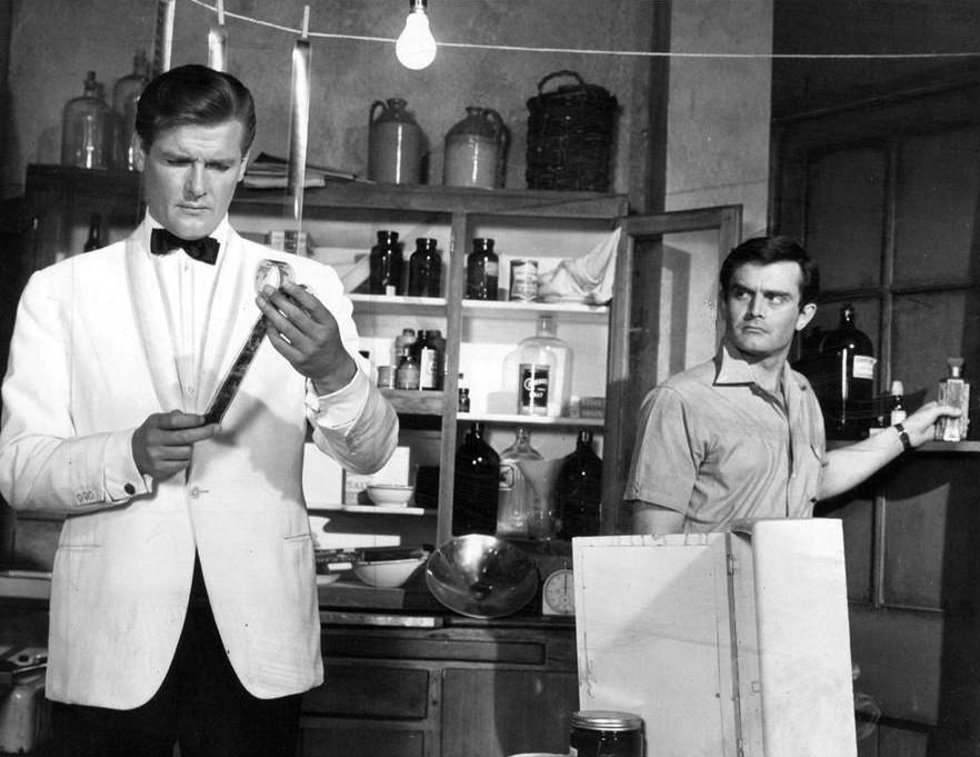 Publicity photo from the television program The Saint. Pictured are Roger Moore and Earl Green. (Creative Commons/Wikimedia)