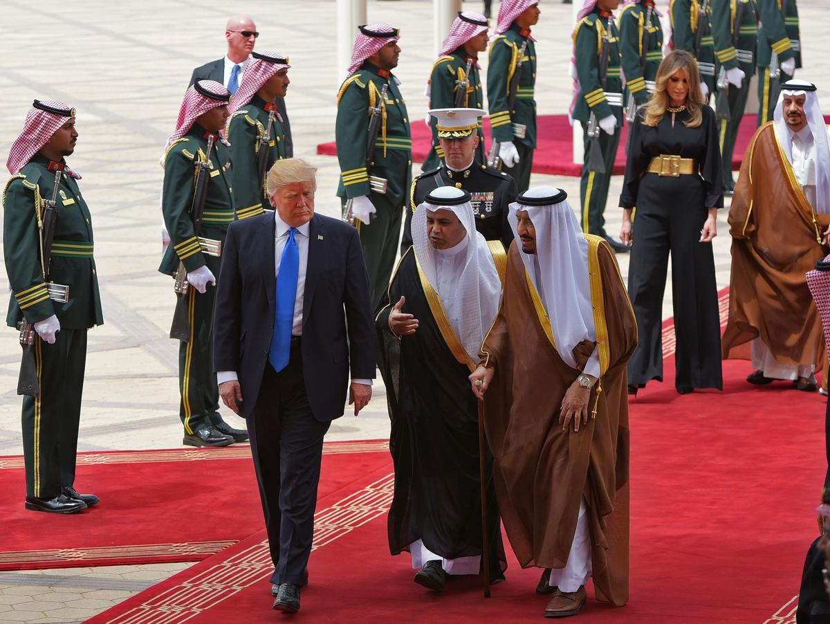 President Donald Trump is welcomed by Saudi King Salman bin Abdulaziz al-Saud (3rd R) upon arrival at King Khalid International Airport in Riyadh on May 20, 2017, followed by First Lady Melania Trump. (MANDEL NGAN/AFP/Getty Images)