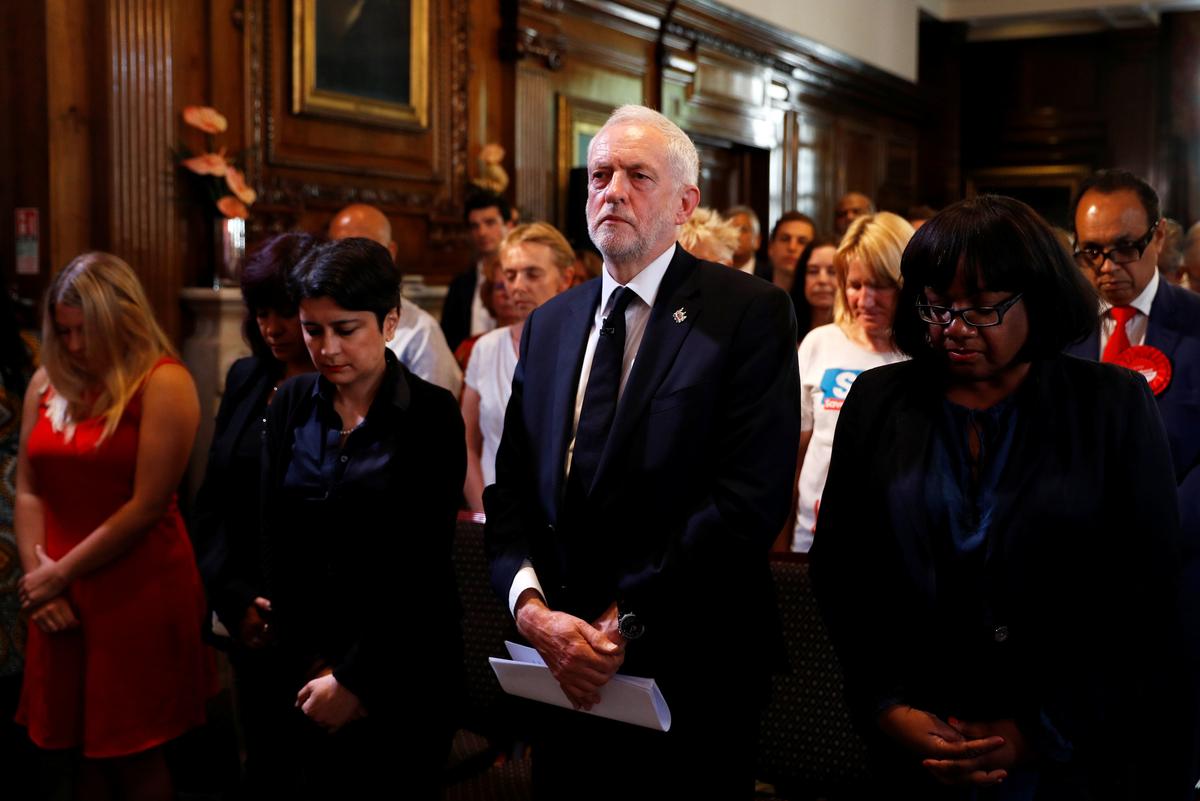 Jeremy Corbyn, the leader of Britain's opposition Labour party, observes a minute's silence for the victims of the attack on the Manchester Arena, before making a speech as his party restarts its election campaign in London on May 26, 2017. (REUTERS/Peter Nicholls)
