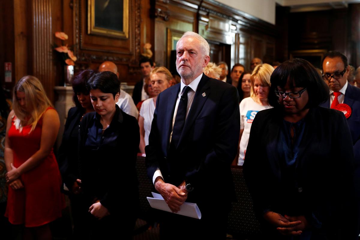 Jeremy Corbyn, the leader of Britain's opposition Labour party, observes a minute's silence for the victims of the attack on the Manchester Arena, before making a speech as his party restarts its election campaign in London on May 26, 2017. (REUTERS/Peter Nicholls)