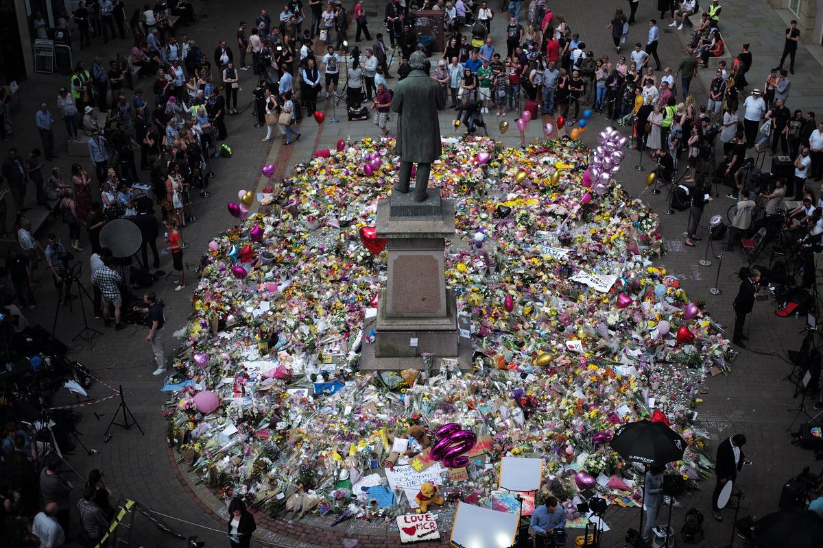 The carpet of floral tributes to the victims and injured of the Manchester Arena bombing covers the ground in St Ann's Square in Manchester, England on May 25, 2017. (Christopher Furlong/Getty Images)