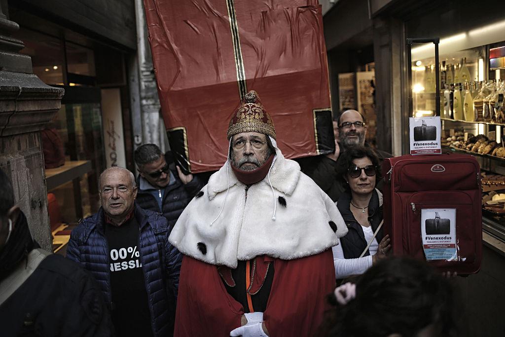 A man wearing clothes of "Doge", the ancient governor of Venice, takes part in a demonstration against the increasing number of tourists in Venice on Nov. 12, 2016. (MARCO BERTORELLO/AFP/Getty Images)