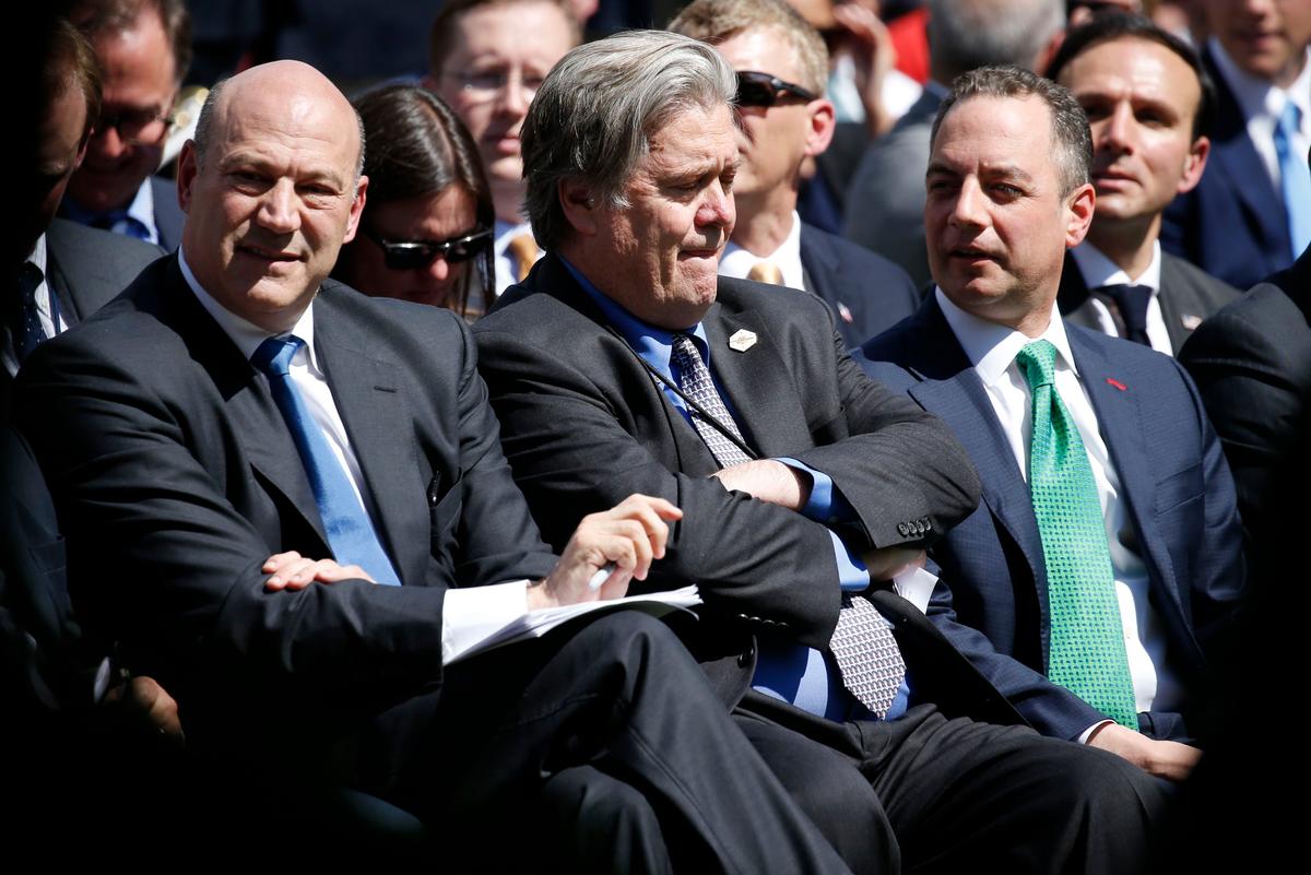 Director of the White House National Economic Council Gary Cohn, White House Chief Strategist Stephen Bannon and Chief of Staff Reince Priebus (L-R) wait in the Rose Garden prior to President Donald Trump announcing his decision on whether the U.S. will remain in the Paris Climate Agreement, at the White House in Washington on June 1, 2017. (REUTERS/Joshua Roberts)