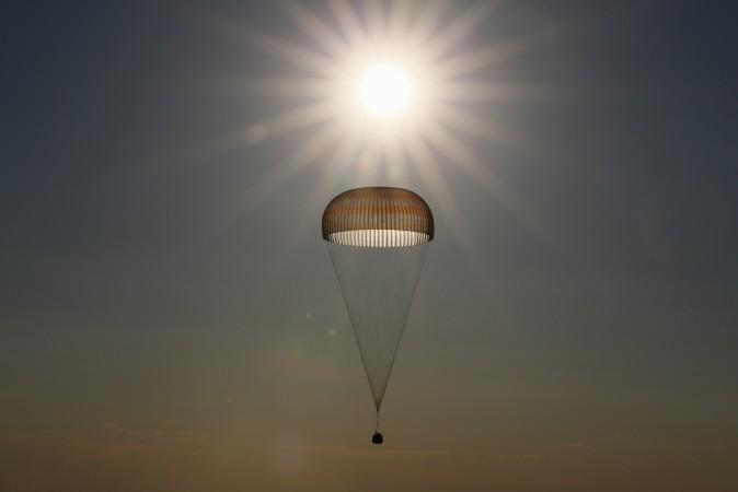 The Soyuz MS-03 space capsule carrying the International Space Station crew of Russian cosmonaut Oleg Novitskiy and French astronaut Thomas Pesquet descends beneath a parachute just before landing in a remote area outside the town of Dzhezkazgan, Kazakhstan, on June 2, 2017. (SHAMIL ZHUMATOV/AFP/Getty Images)