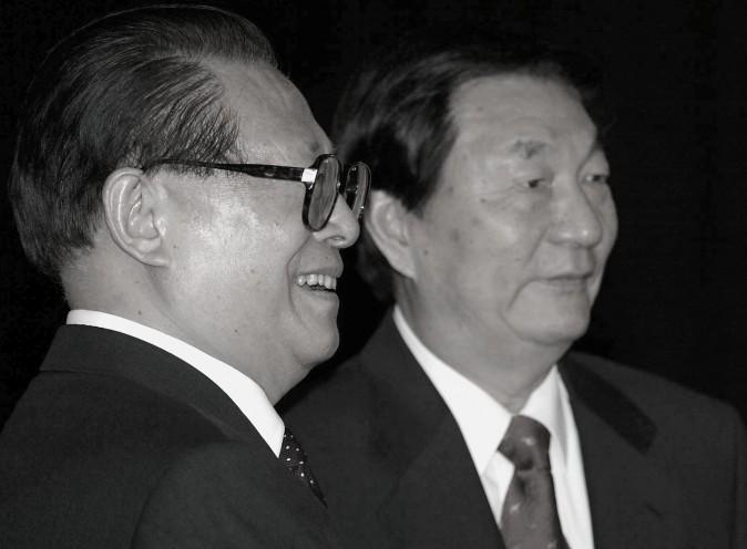 Chinese President Jiang Zemin (L) together with Premier Zhu Rongji during a departure ceremony at the Great Hall of the People in Beijing 03 June 2002. (Goh Chai Hin/AFP/Getty Images)