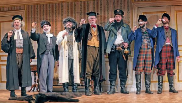 The talented acts playing a cast of silly characters in "The Government Inspector": (L–R) Tom Alan Robbins, Stephen DeRosa, James Rana, David Manis, Luis, Moreno, Ryan Garbayo, and Ben Mehl. (Carol Rosegg)