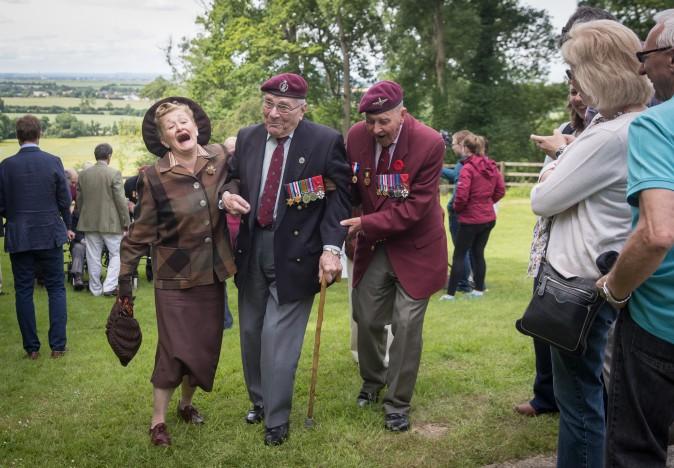 Paratrooper Gordon Newton (C) who was in the 9th battalion and Geoff Paterson 9th Para (R) share a joke as they commemorate the 73rd anniversary of the D-Day landings near Caen, France, on June 5, 2017. D-Day landings, which is commemorated on June 6, saw 156,000 troops from the allied countries, including the United Kingdom and the United States, join forces to launch an audacious attack on the beaches of Normandy, and these assaults are credited with aiding the eventual defeat of Nazi Germany. (Matt Cardy/Getty Images)