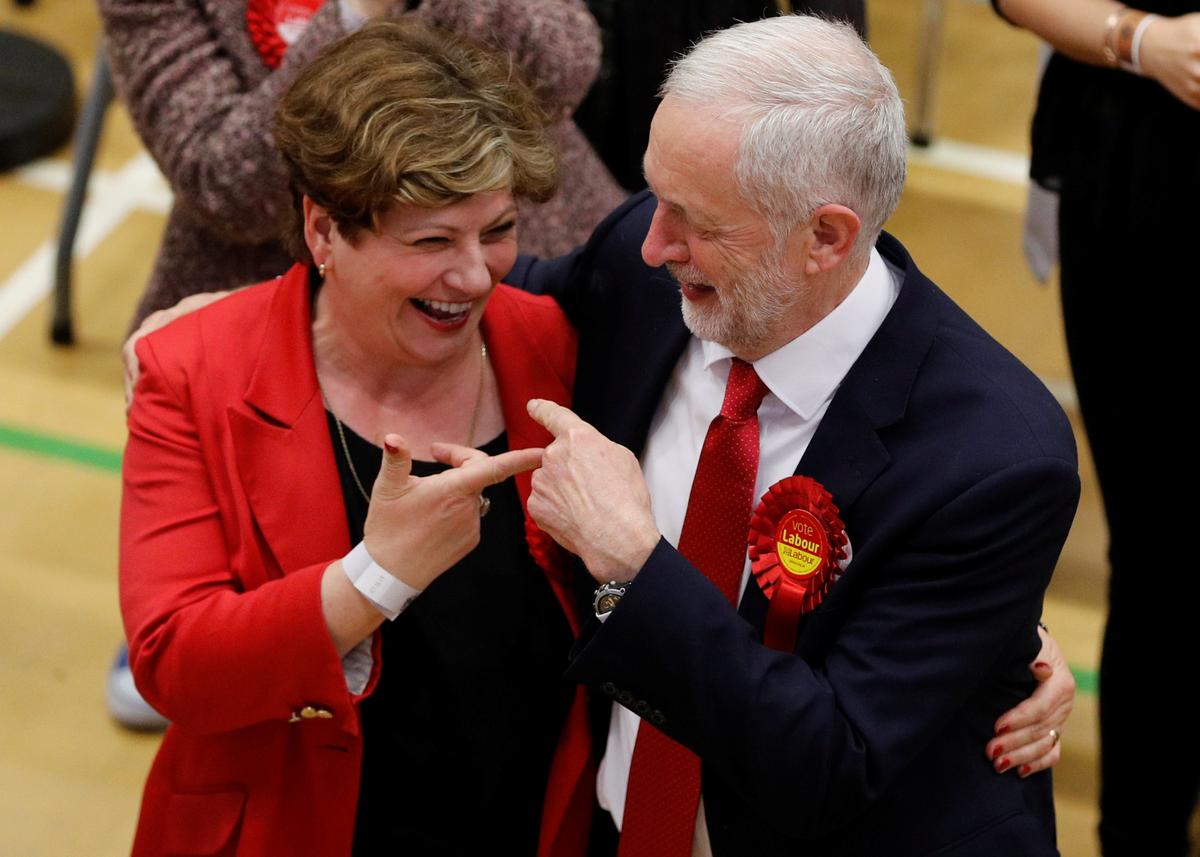 Jeremy Corbyn, leader of Britain's opposition Labour Party, and Labour Party candidate Emily Thornberry gesture at a counting centre for Britain's general election in London on June 9, 2017. (REUTERS/Darren Staples)
