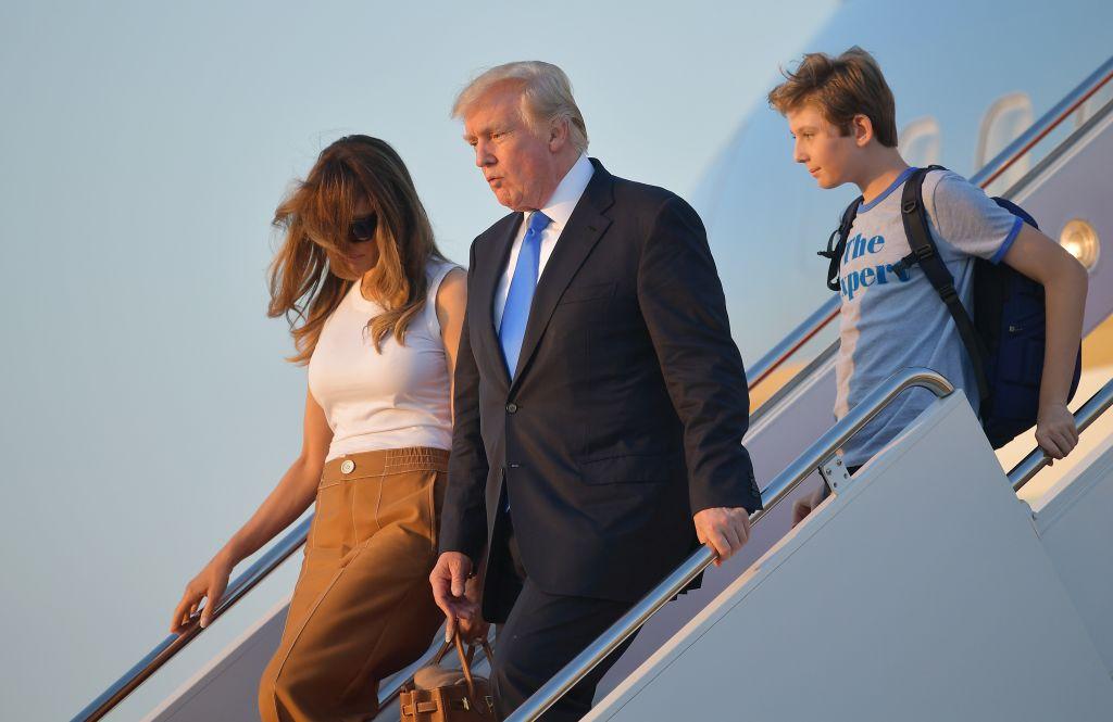 President Donald Trump (C), first lady Melania Trump, and their son Barron Trump walk off Air Force One after arriving at Andrews Airforce base, Maryland on June 11 2017. (MANDEL NGAN/AFP/Getty Images)
