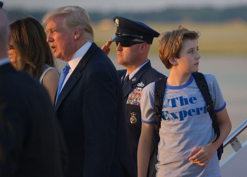 Barron Trump (R), the son of President Donald Trump (2L) and First Lady Melania Trump (L) look back at Air Force One upon arrival at Andrews Air Force Base in Maryland on June 11, 2017. (MANDEL NGAN/AFP/Getty Images)