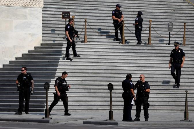 U.S. Capitol Police keep watch on Capitol Hill following a shooting in nearby Alexandria, in Washington, U.S., June 14, 2017. REUTERS/Aaron P. Bernstein