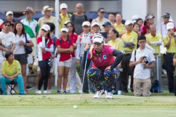 Hong Kong Open winner Supamas Sangchan of Thailand lines up a put on the 18th green before claiming the EFG Hong Kong Ladies Open title at Fanling Golf Club, on Sunday June 11, 2017. (Dan Marchant)