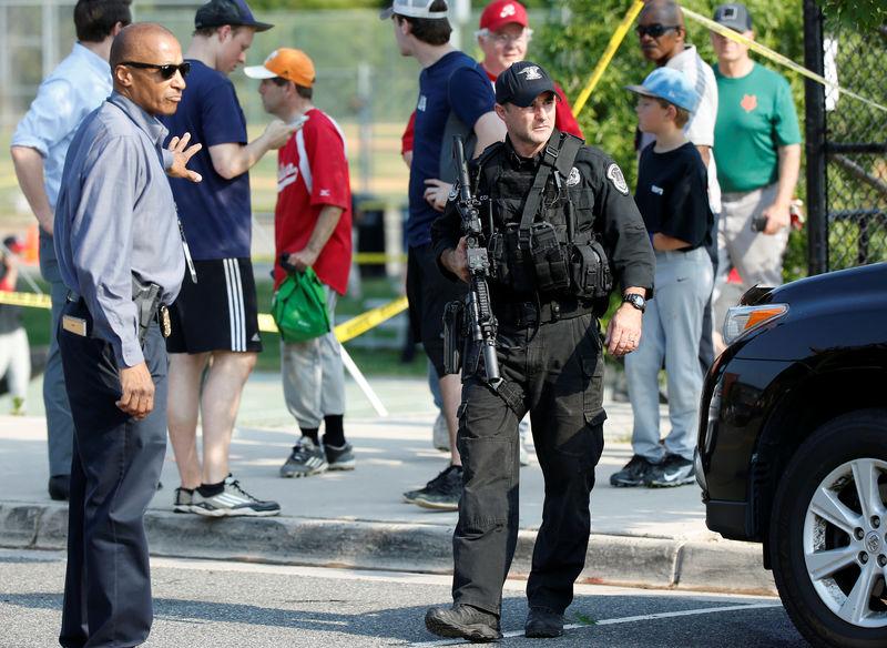 Police investigate a shooting scene after a gunman opened fire on Republican members of Congress during a baseball practice near Washington in Alexandria, Virginia on June 14, 2017. (REUTERS/Joshua Roberts)
